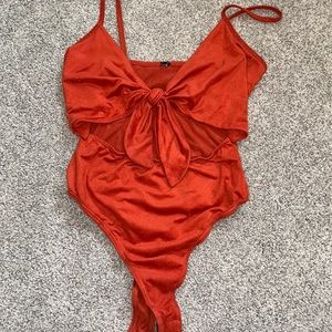 Orange body suit